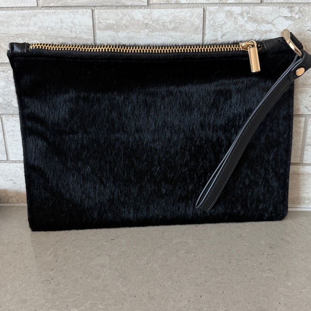Like new faux fur Black wristlet Bag